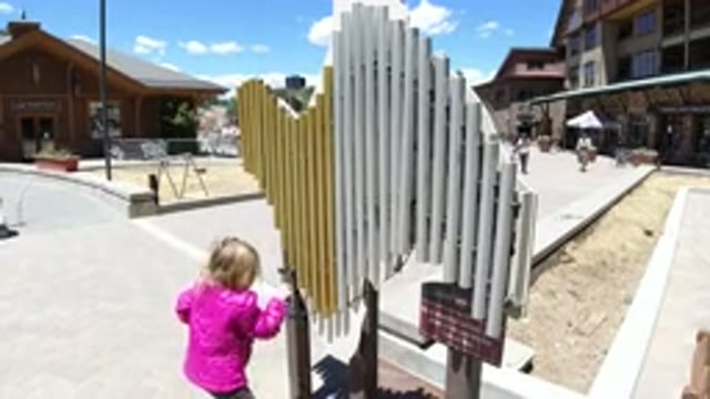 WINTER PARK COLORADO-2019: Little Blonde Girl Playfully Having Fun In The City