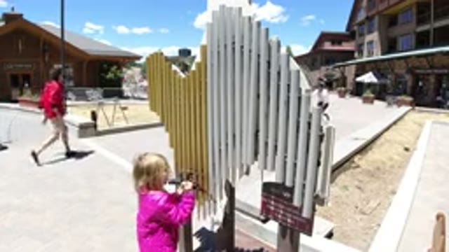 WINTER PARK COLORADO-2019: Little Girl In Her Jacket Is Outside Playing With A