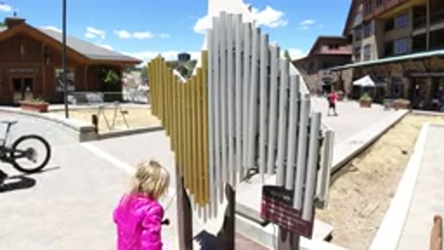 WINTER PARK COLORADO-2019: Little Girl In A Pink Jacket Playing On The Playground