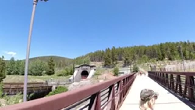 WINTER PARK COLORADO-2019: A Lady And A Little Girl Walking Over A Beautiful Bridge