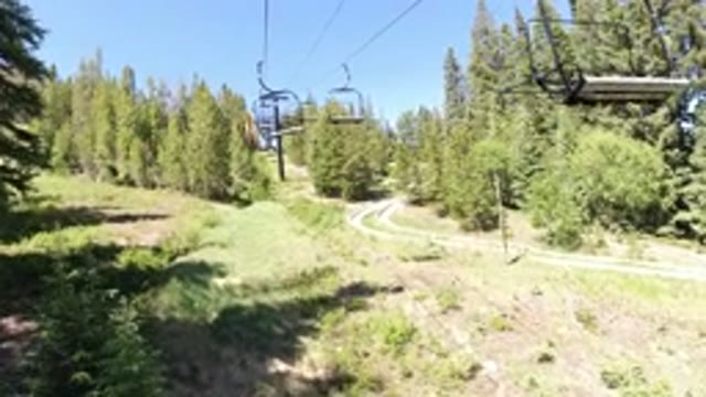 WINTER PARK COLORADO-2019: Someone Rides A Cableway Through The Forest