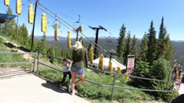 WINTER PARK COLORADO-2019: Mother And Daughter Watching Gliders On A Trail At A