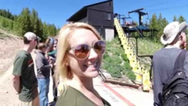 WINTER PARK COLORADO-2019: Happy Blonde Woman Smiles and Gives Peace Sign
