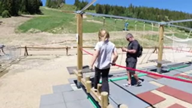 WINTER PARK COLORADO-2019: Children Play On A Playground Obstacle Course On A