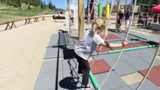 WINTER PARK COLORADO-2019: Little Blonde Girl Having Fun Playing In The Park