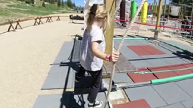 WINTER PARK COLORADO-2019: A Small Girl Walking On A Rope And Entering