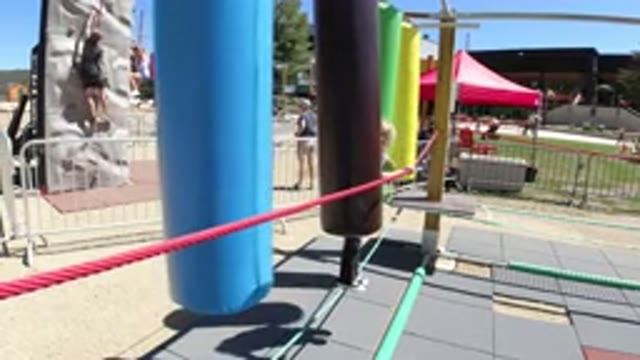WINTER PARK COLORADO-2019: A Girl Walking On A Rope And Colorful Punching Bags