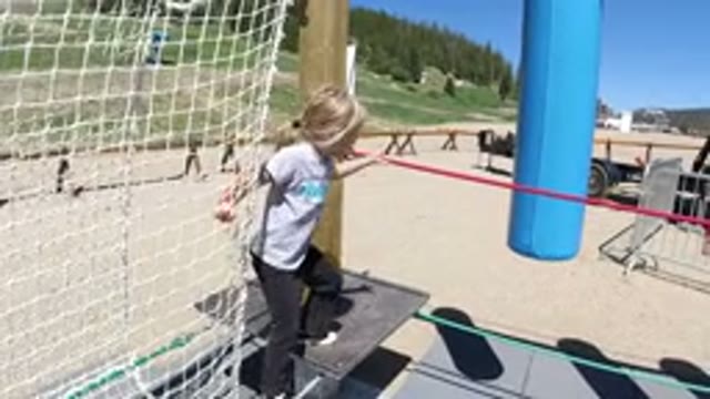WINTER PARK COLORADO-2019: Girl Holding Red Rope On Obstacle Course In