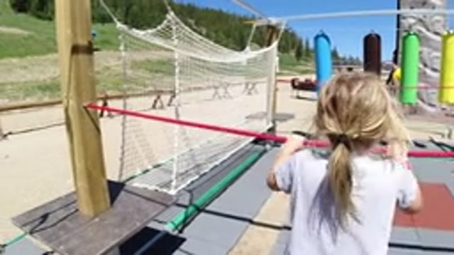 WINTER PARK COLORADO-2019: A Girl Walking On A Rope In A Park