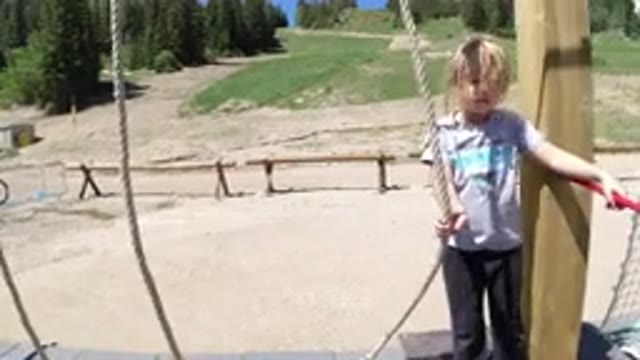 WINTER PARK COLORADO-2019: Child Enjoying Jungle Gym At Adventure Park On