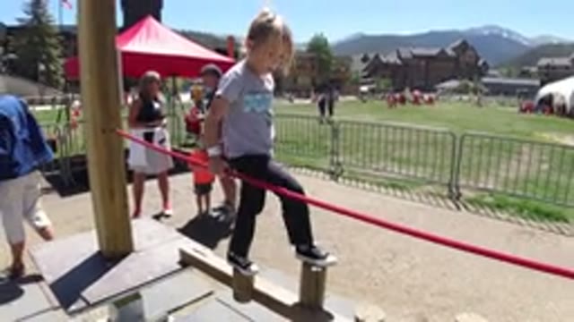 WINTER PARK COLORADO-2019: Child Using Rope To Walk Across Balance Beam