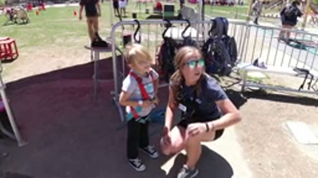 WINTER PARK COLORADO-2019: A Young Lady Sitting On Knees Instructing A Boy