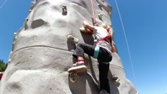 WINTER PARK COLORADO-2019: A Kid Learning To Rock Climb On A Wall