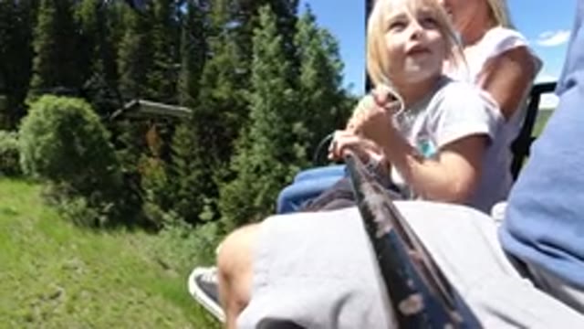 WINTER PARK COLORADO-2019: Ropeway Ride with Child, Man and Woman Sitting Together