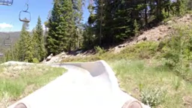 WINTER PARK COLORADO-2019: A Person Sliding Down A Concrete Ramp On A Board