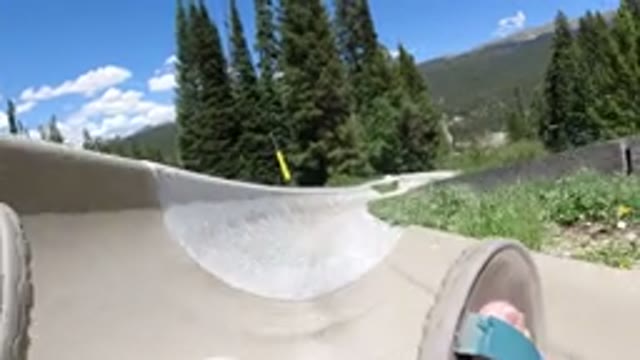 WINTER PARK COLORADO-2019: Person Going Down A Slide Or Luge With Feet Shown