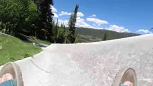 WINTER PARK COLORADO-2019: Person's Feet As The Person Slides Down A Luge