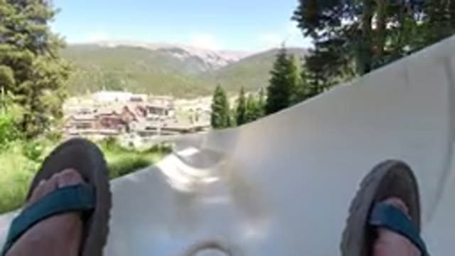 WINTER PARK COLORADO-2019: Person Going Down A Very Large Slide In Sandals By A