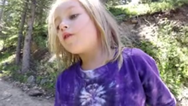 WINTER PARK COLORADO-2019: A Little Girl Talking and Her Mother Walking in the Snow