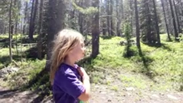 WINTER PARK COLORADO-2019: Little Girl With Pretty Blonde Hair Is Walking
