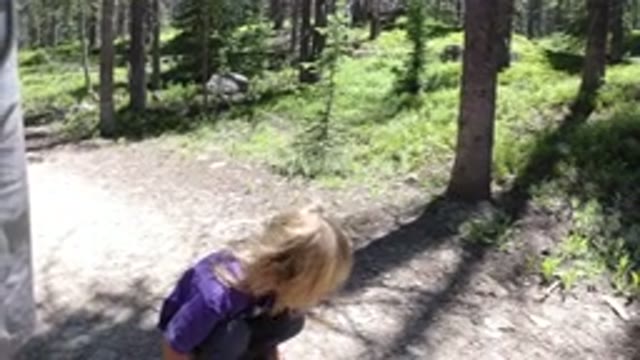 WINTER PARK COLORADO-2019: A Baby Playing Outdoors With a Stick in the Snow