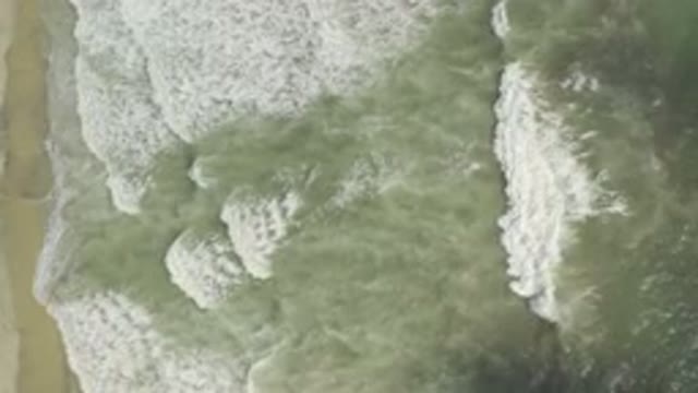 LOS CABOS MEXICO-2019: Green Water Sea Waves Crashing At The Beach Captured By