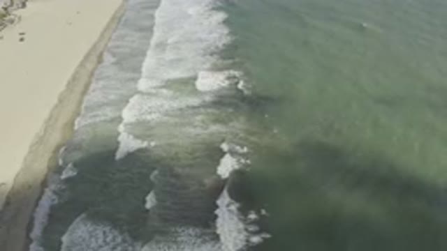 LOS CABOS MEXICO-2019: Oddly Greyish Green Water Sea With Waves Crashing