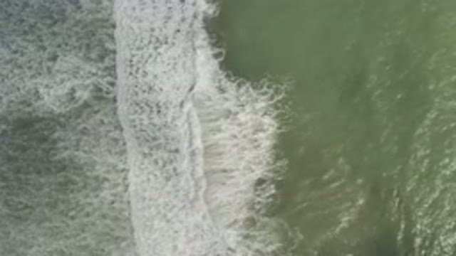 LOS CABOS MEXICO-2019: Waves From A Cloudy Ocean Crashing On The Beach