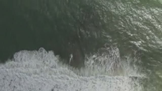 LOS CABOS MEXICO-2019: Drone Camera In The Sky Recording Green Water Sea And