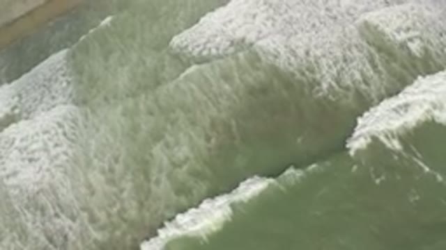 LOS CABOS MEXICO-2019: Oddly Wavy Green Ocean Water With Calm and Slow Waves