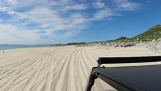 LOS CABOS MEXICO-2019: Truck Being Driven On The Sand With A Scenic View Of The