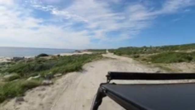 LOS CABOS MEXICO-2019: A Vehicle Moving On A Sand Stone Road Alongside Of A