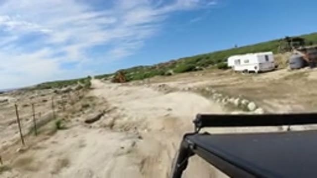 LOS CABOS MEXICO-2019: Person Driving Car Through Sandy Road In The Beach During