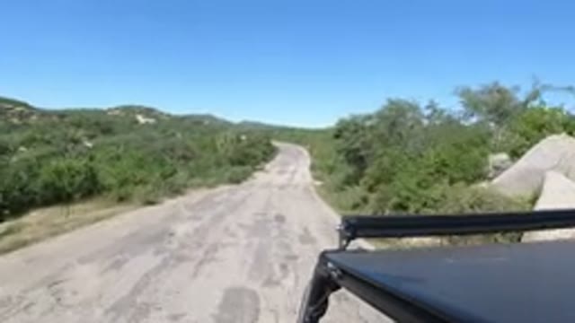 LOS CABOS MEXICO-2019: Driving Down A Dirt Road In The Desert In A Jeep