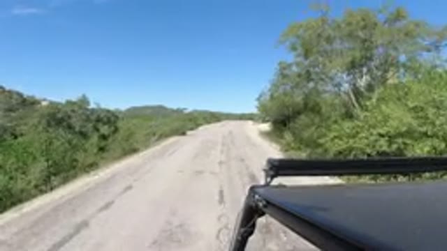 LOS CABOS MEXICO-2019: A Vehicle Moving Fast Through A Straight Road In The