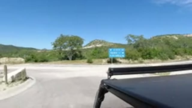 LOS CABOS MEXICO-2019: A Vehicle Travels Through a Tree-Lined Path