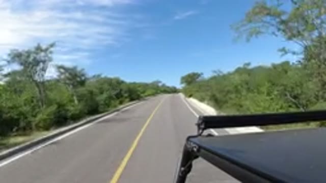 LOS CABOS MEXICO-2019: Camera Mounted On Top Of A Jeep Moving Down A Country Road