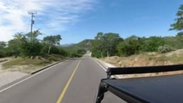 LOS CABOS MEXICO-2019: Car Driving Through A Highway With Sand On The Road
