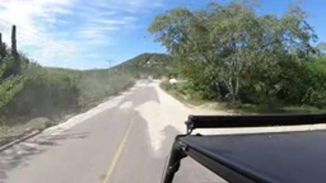 LOS CABOS MEXICO-2019: A Car Driving Along A Road The Camera Positioned At The Top Left Showing The Roof
