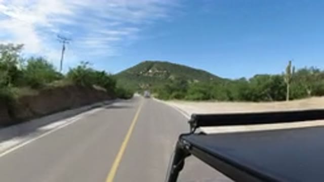 LOS CABOS MEXICO-2019: Driving A Go Kart Through A Hilly Barren Desert Landscape