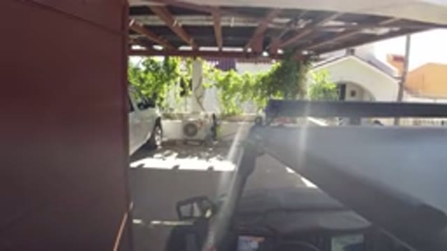 LOS CABOS MEXICO-2019: Large SUV Reversing Out of Driveway on Sunny Day