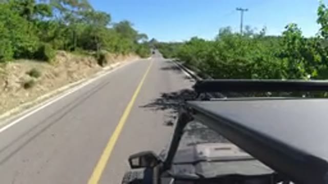 LOS CABOS MEXICO-2019: Jeep Driving Through A Highway During The Day Surrounded