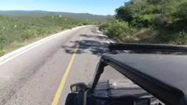 LOS CABOS MEXICO-2019: Speeding Down A Rural Road In An Atv With The Sun At Your