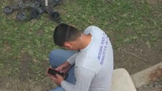LOS CABOS MEXICO-2020: Lazy Drywall Worker Browsing TikTok on His Phone