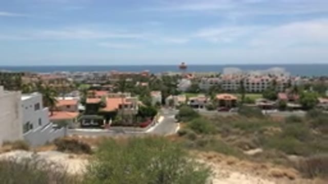 LOS CABOS MEXICO-2020: A Shot Pans Out Over A Seaside Town Showing Off Local