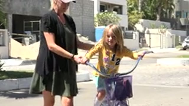 LOS CABOS MEXICO-2020: Little Girl Feels Happy Riding A Bicycle