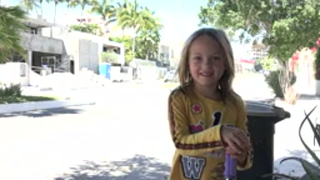 LOS CABOS MEXICO-2020: A Blonde Child In A Yellow Blouse Shorts And Long Socks