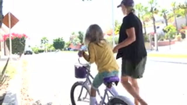LOS CABOS MEXICO-2020: Mom Teaching Her Daughter How To Ride A Bicycle For The