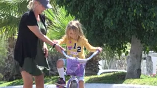 LOS CABOS MEXICO-2020: Daughter Ride A Bicycle With Her Mom By Her Side
