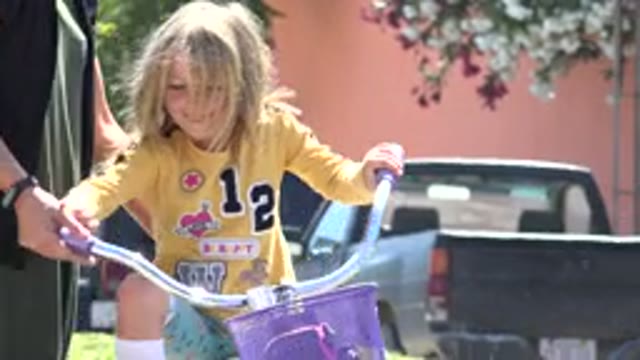 LOS CABOS MEXICO-2020: Mother Teaches Daughter To Ride Bike Outside During A